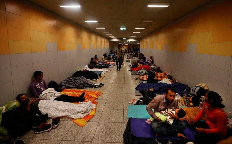 Frustrated refugees in Budapest vow to walk to Vienna