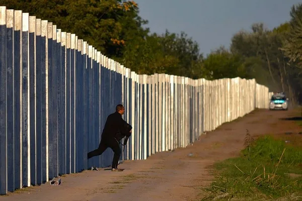 Merkel demands EU partners share in burden of human tide
