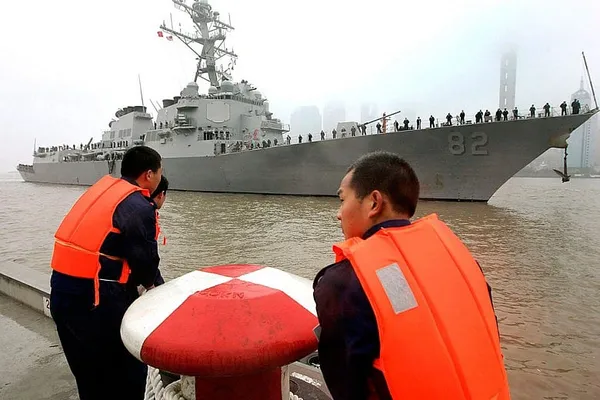 China warns US Navy after ship sails by Chinese-built island