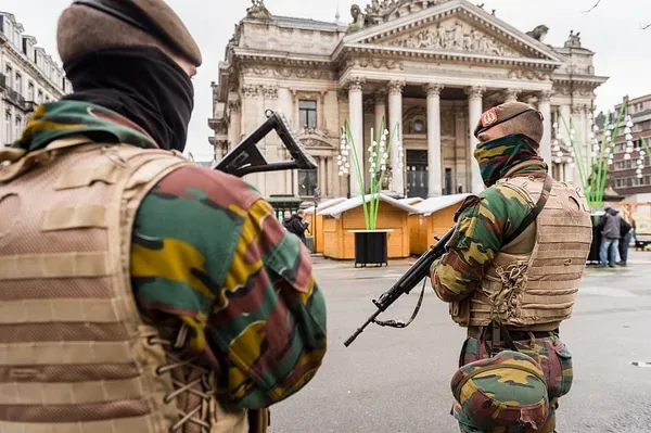 Belgium police arrest 16, Paris fugitive still at large