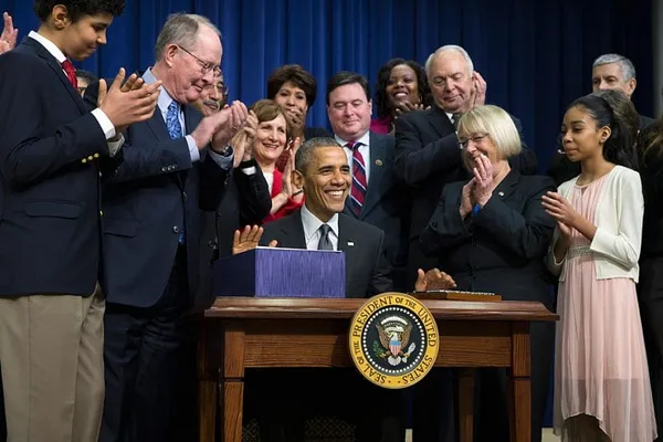 Obama signs education law rewrite shifting power to states