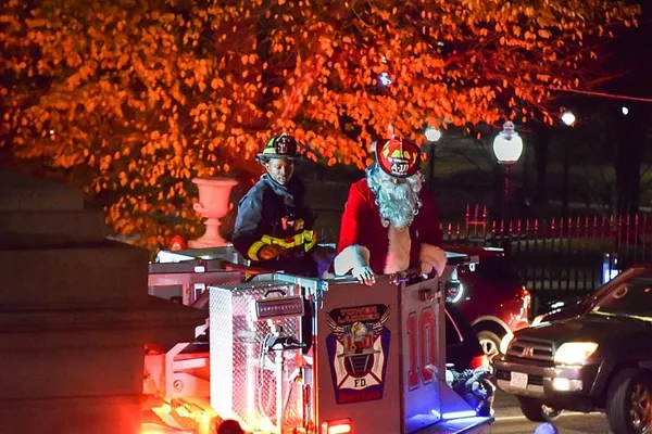 Carols ring across Beacon Hill as Christmas tree lights shine
