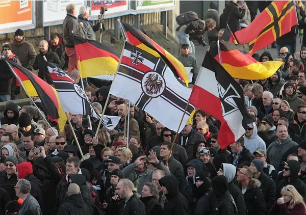 Germans protest assaults in Cologne as Merkel pledges new laws