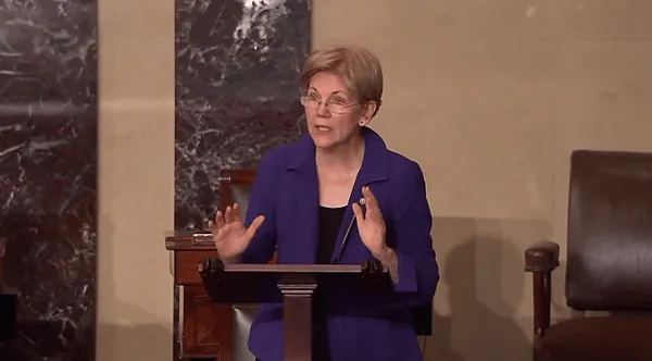 Warren sharpens Trump critique, deflects Clinton questions