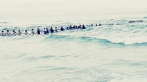 Human Chain Beach Heroes Helped Save A Family; Maybe They Can Help Save A Nation