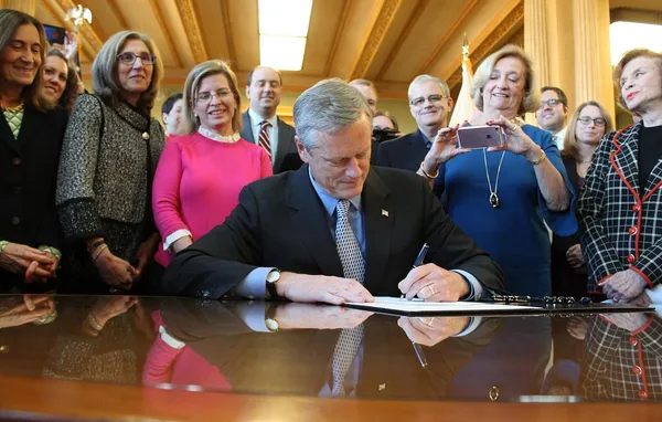 Surrounded by Democrats, Baker Signs Bill Guaranteeing Free Birth Control Into Law