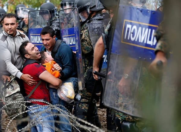 Macedonian troops fire stun grenades at Middle East migrants