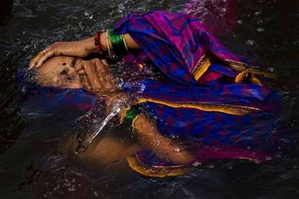 India’s river waters cleanse spirits at Hindu festival