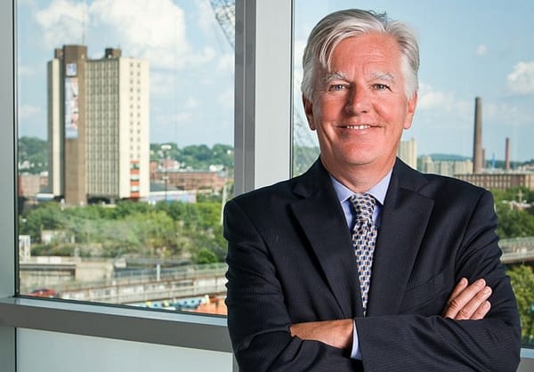 On heels of tuition hike, Meehan agrees to pay faculty pay raises