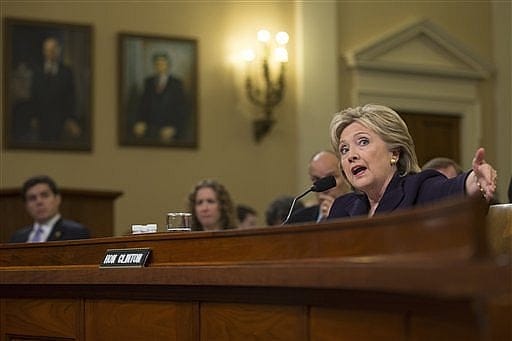 Clinton attempts to deflect Benghazi queries