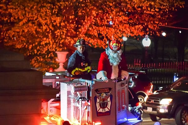Carols ring across Beacon Hill as Christmas tree lights shine