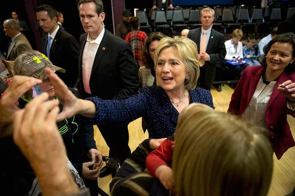 Clinton confronts rival Sanders as Iowa polls tighten