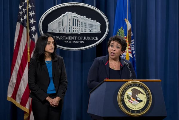 Ferguson sued after vote to revise Justice Department deal