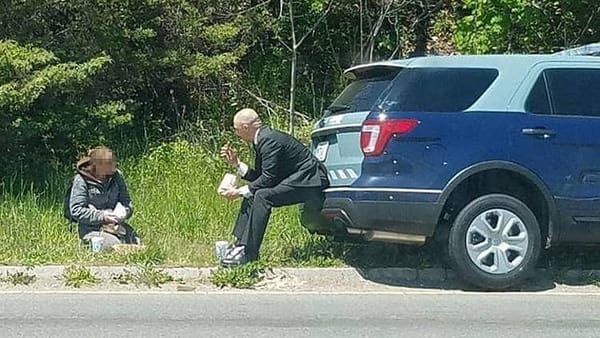Massachusetts Trooper breaks bread with panhandler