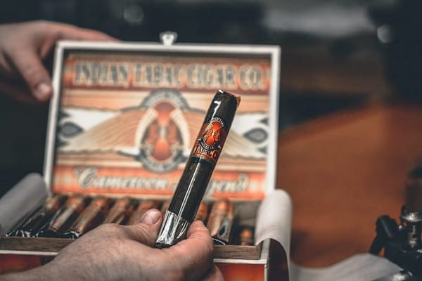 State Rep Donald Wong Congratulates Departing House Speaker Bob DeLeo On Career With Cigar